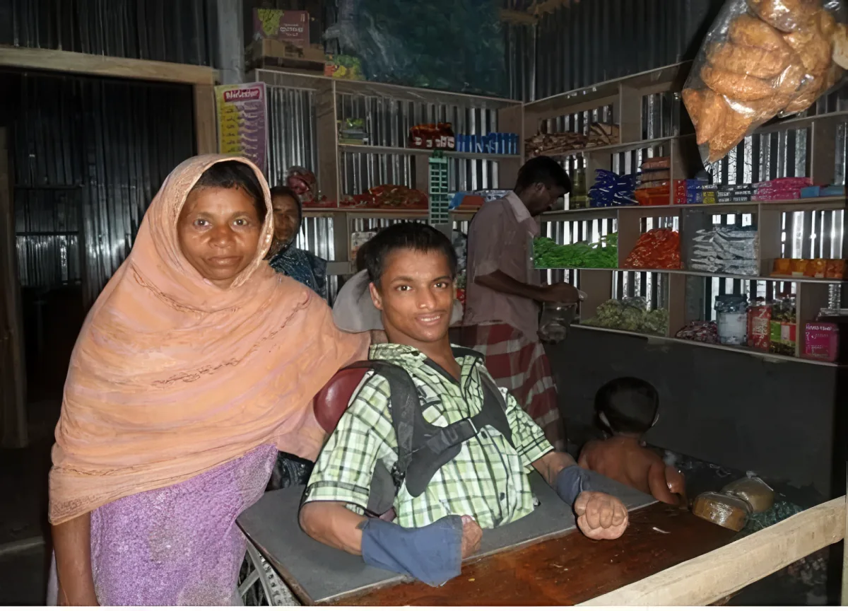 A young man running his grocery shop after rehabilitation